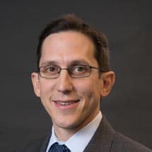 Portrait of Jon Ansari, Executive Vice President & CFO of Magyar Bank, smiling warmly. Title: Jon Ansari – Executive Vice President & CFO of Magyar Bank
